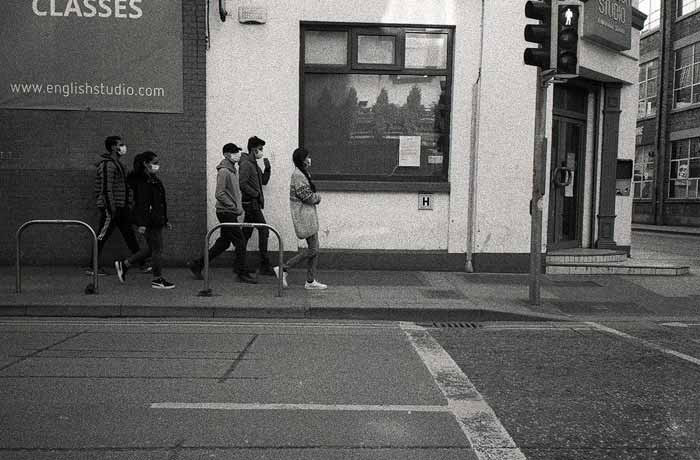 Fig. 26 A group of young people, possibly English language students. walk the empty streets during the pandemic