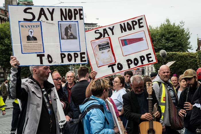 Fig.4 People gathered outside the G.P.O on O'Connell Street. They went out of their way to attend and bring placards made from whatever was available.