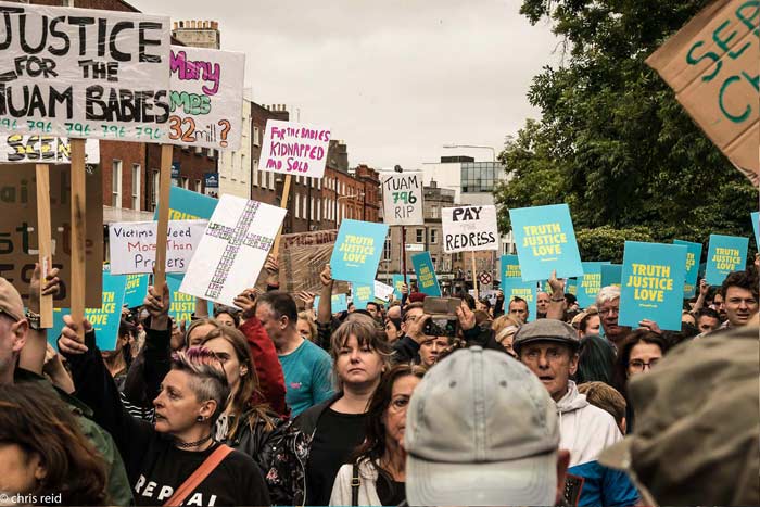 Fig.15 Outside the Garden of Remembrance looking down towards O'Connell Street. People holding banners that publicly highlight unresolved issues and crimes.